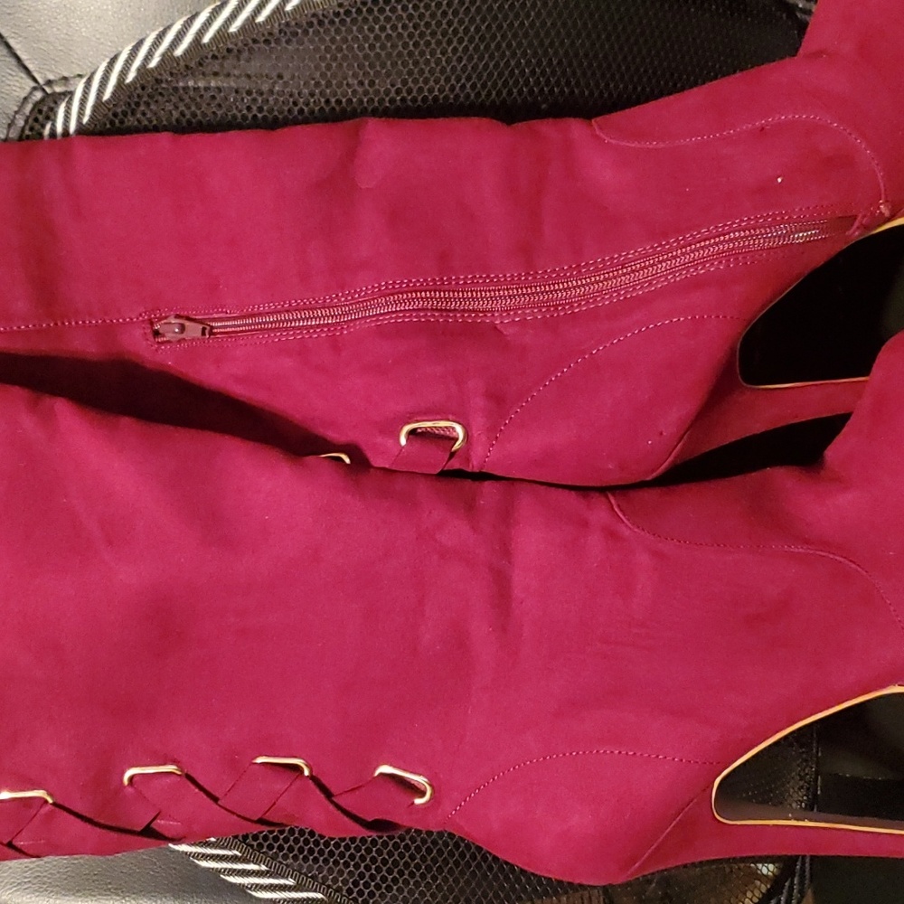 Jannellea Brand cranberry colored thigh high, laced platform stilletto boot.